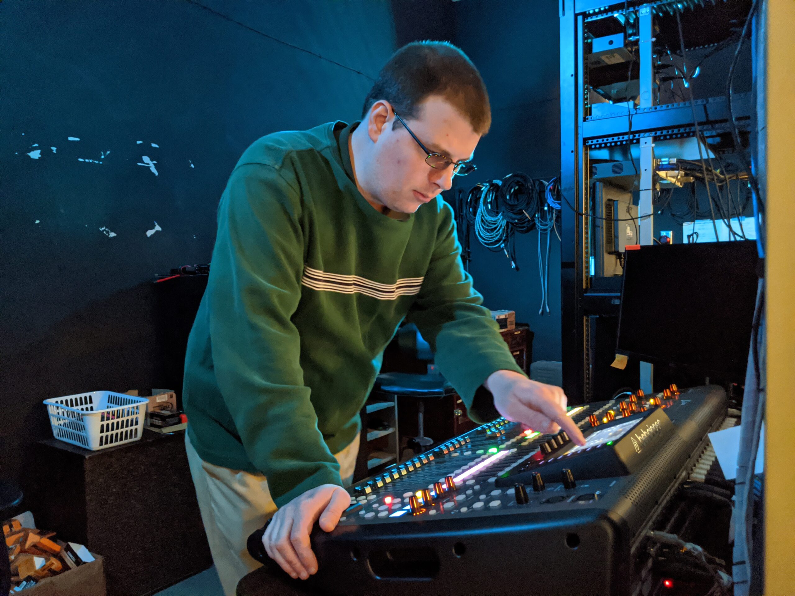Photo of Shaun Speers working on the sound board